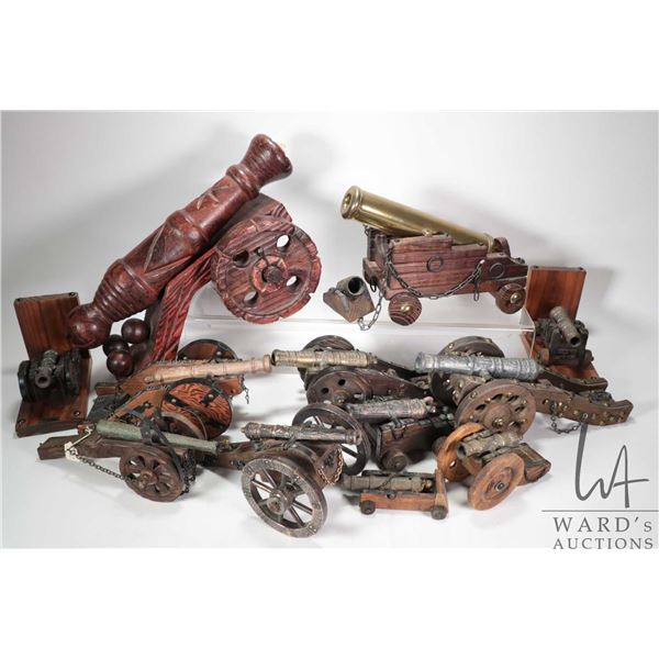 Selection of collectibles including cannons, bookends, various metals including brass plus 17" woode