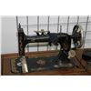 Image 2 : Antique Seamstress treadle sewing machine in decorative oak cabinet