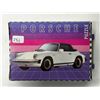 Image 1 : Porsche 911 Cabrio Puzzle. 54 different pieces, when put together, they become a 7” X 5[x=#
