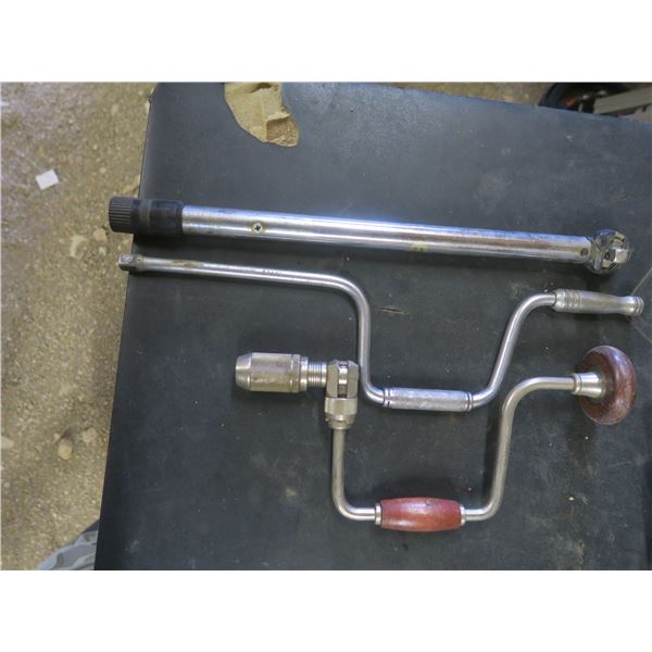 two hand wrenches and breaker bar