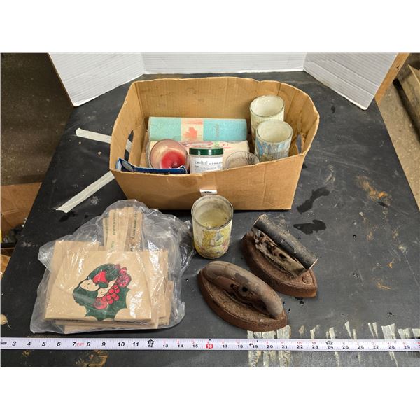 Assorted candles and sad irons