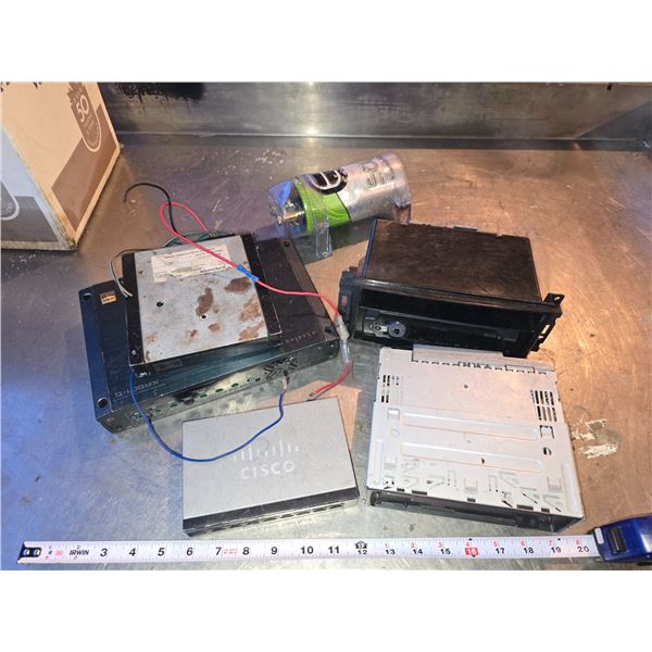 Box of vehicle items - car stereo deck, amp, transducer, etc.