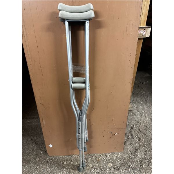 2 Sets of adjustable crutches.