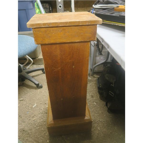 large wooden pedestal