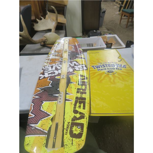 snow board (damaged) + twisted tea tin sign