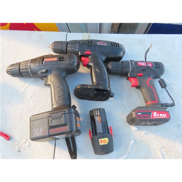 assorted drills and assorted batteries