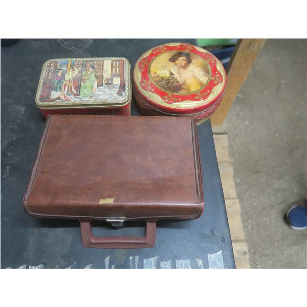two vintage tin containers and cassette case