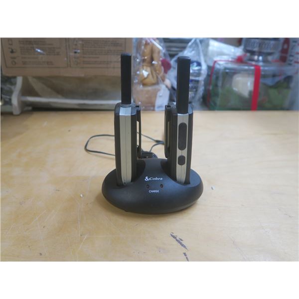 two walkie talkies with base