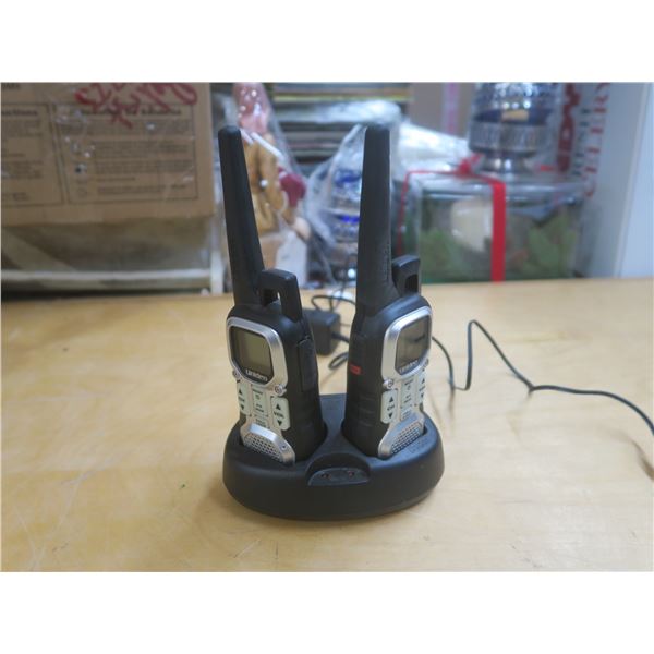 two walkie talkies with base