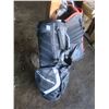 Image 4 : two golf bags with some clubs
