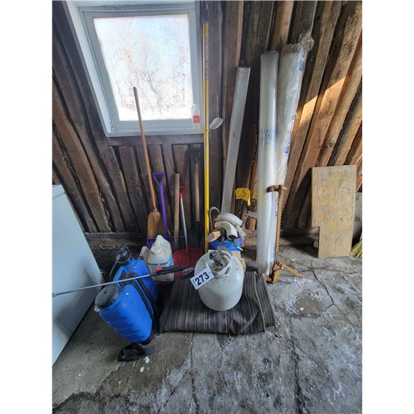 Wire stretcher, rolls of plastic, sprayer, shovels, bar, camping tarp