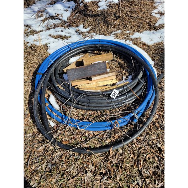 Blue water line hose & black sewage line hose & misc. wood
