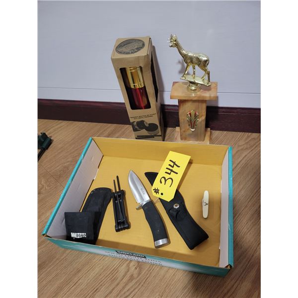 Trophy's, small thermos, buck knife & multi tool