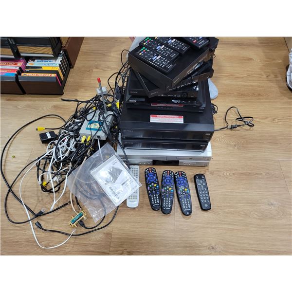 Qty of VHS/DVD players, remotes, AV cords etc.