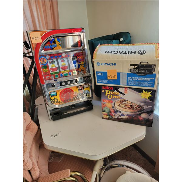 Japanese Pachislo slot machine, 2- chairs, table, VHS movie camera, Salton pizza oven, single inflat