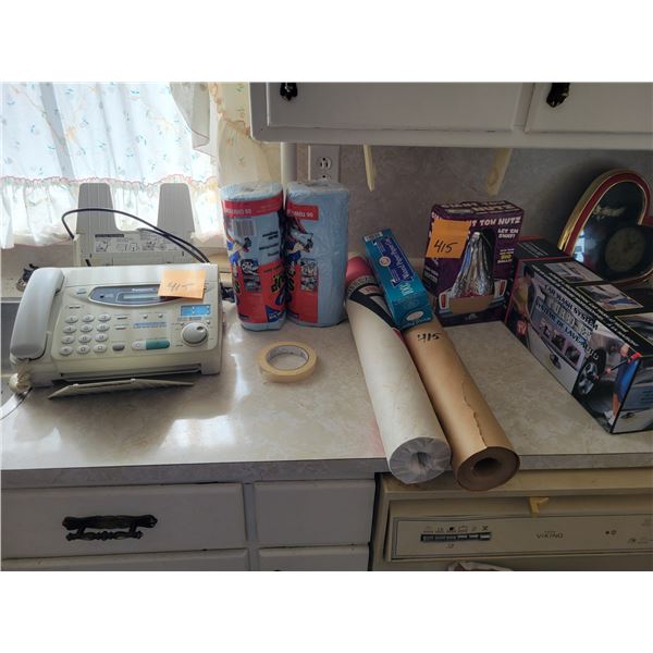 Fax machine, 2- rolls of chiffons, 2- rolls of meat wrapping paper, giant tow Nutz & cash wash wand