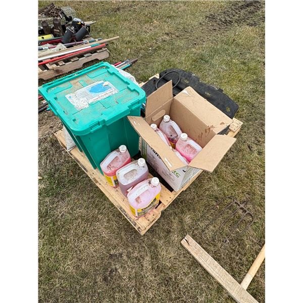 7- Jugs of windshield washer fluids, green tote & misc.