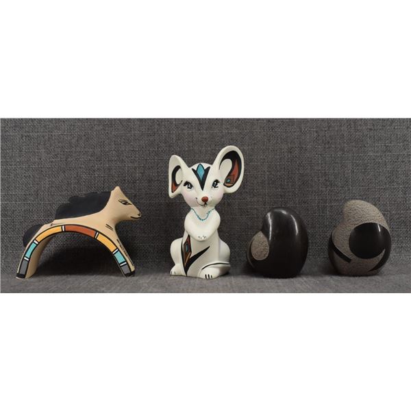 FOUR POTTERY FIGURES