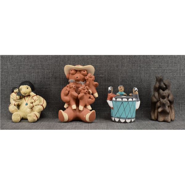 FOUR POTTERY FIGURES
