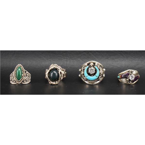 FOUR NAVAJO STERLING AND STONE RINGS.
