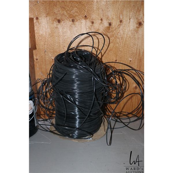 Partially used spool of black screening spline.