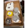 Image 1 : Carbon monoxide detectors, tape measures, and lightbulbs