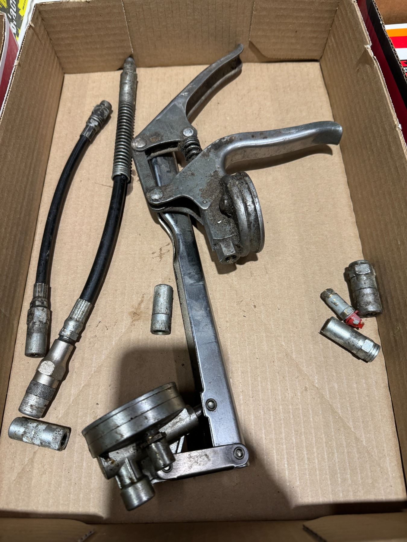 Assorted grease gun parts