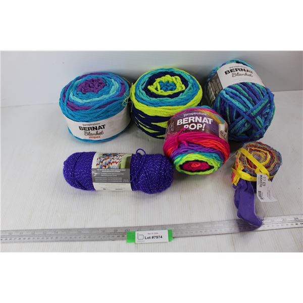 (5) Balls Of Yarn, (1) Roll Of Fabric Scraps