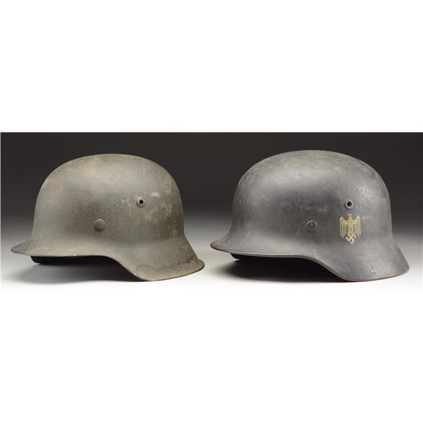 2 WWII GERMAN HELMETS.