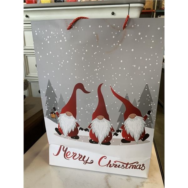 ELDERLY CHRISTMAS BAG WITH 3 ARTICLES OF CLOTHING AND TRAVEL COUPON $20-$100