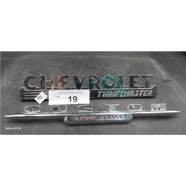 Pair of vintage car emblems, Chevrolet & Custom