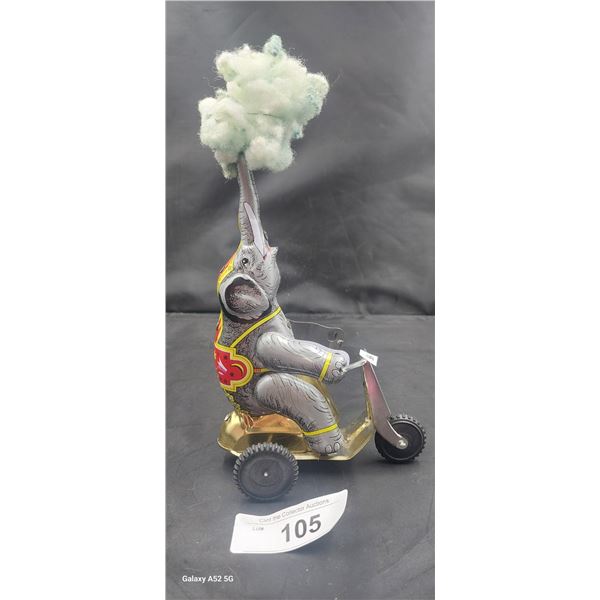 Vintage windup toy elephant on trike