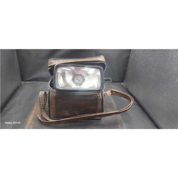 Vintage car light in leather case
