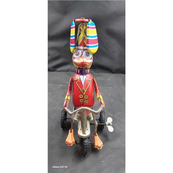 Vintage windup funny action duck on bike