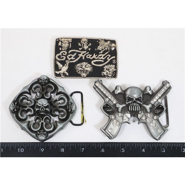 THREE BELT BUCKLES INCLUDING SKULLS, AND ED HARDY