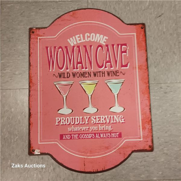 Metal Woman Cave Sign