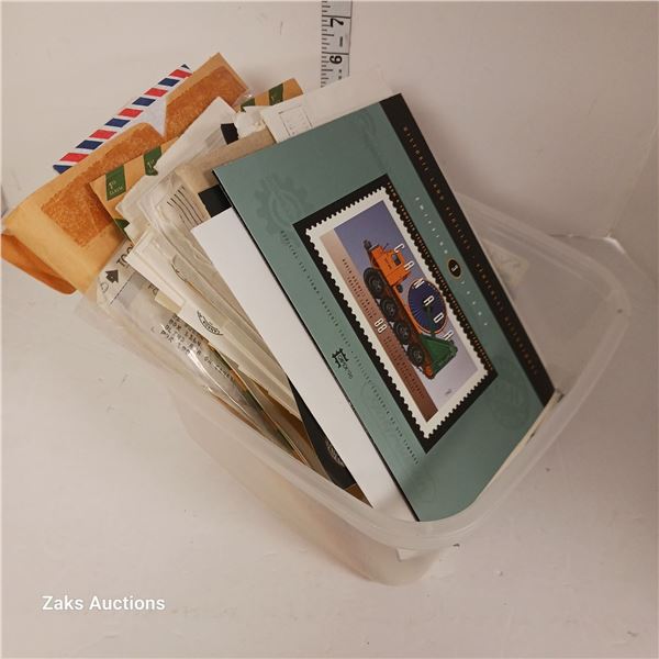Plastic Tub with Stamps and Empty Used Envelopes