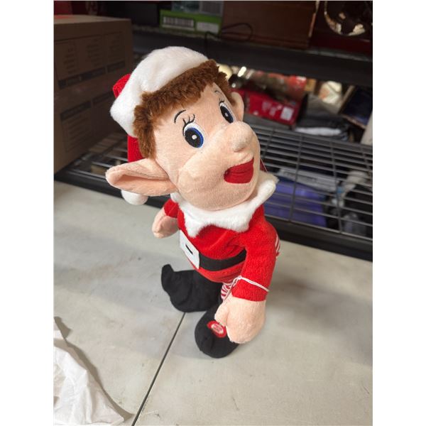 Singing dancing elf working
