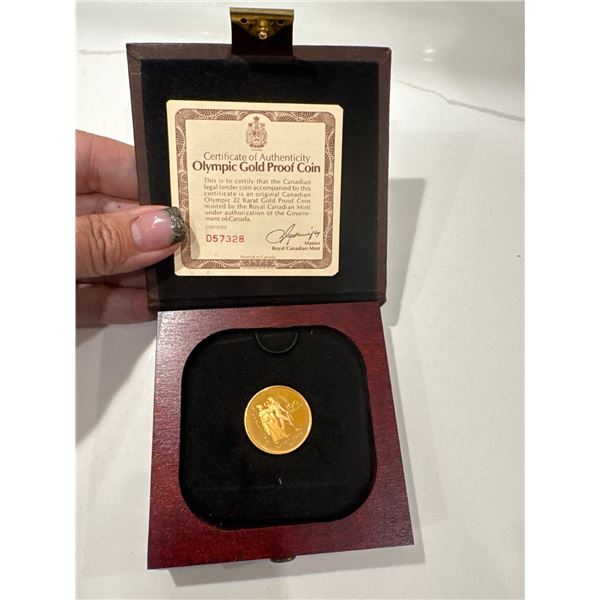 Olympic gold proof coin 22 karat gold proof$100 coin