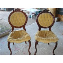 Pair of carved wood chairs