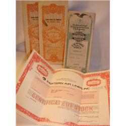 4 old stock certificates