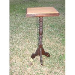 Against the wall pedistal table