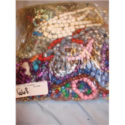 Large bag stuffed full of costume jewelry
