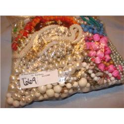 Large bag stuffed full of costume jewelry