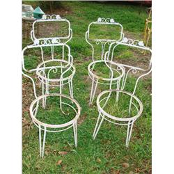4 white iron chairs
