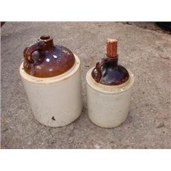 2 old whiskey jugs