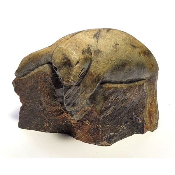 30)  HAND CARVED HARBOUR SEAL ON ROCKS, FROM
