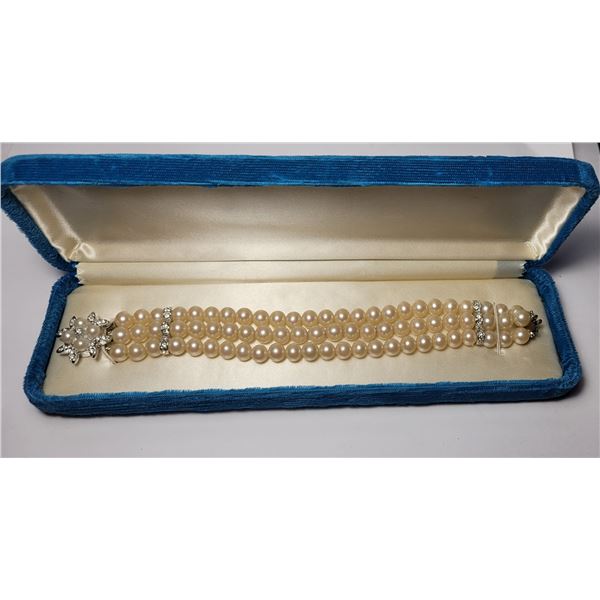 24)  IN A VINTAGE BIRKS' VELVET BOX, 3 STRAND WITH