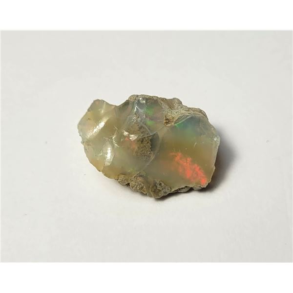 27)  NATURAL 6 CT ROUGH ETHIOPEAN FIRE OPAL.