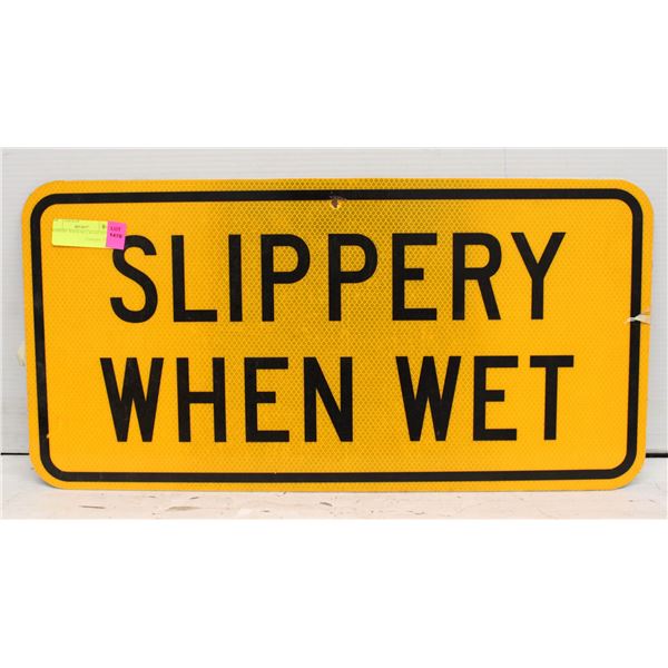 SLIPPERY WHEN WET ROAD SIGN
